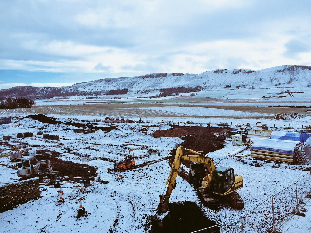 House build and snowy landscape